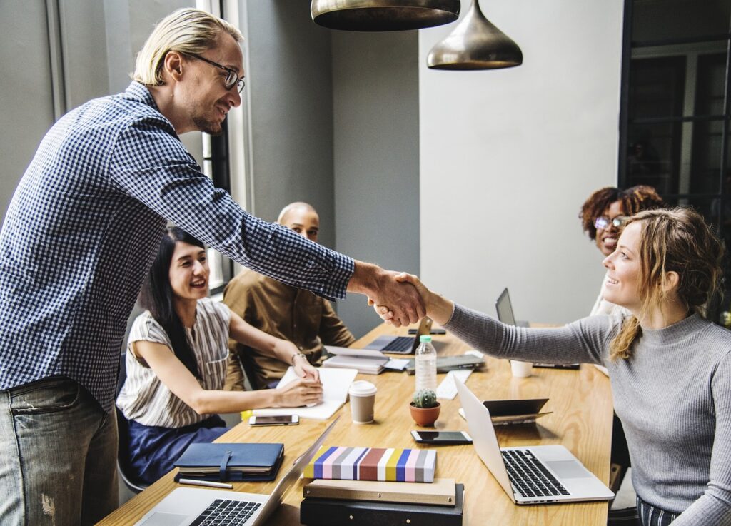 Man shaking a woman's hand