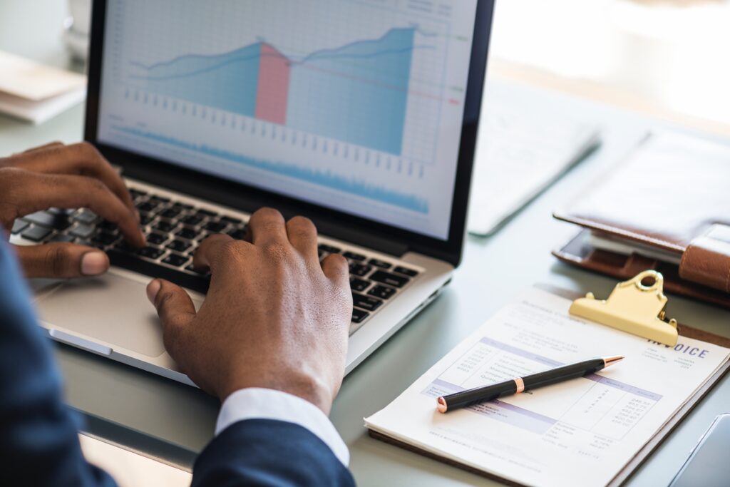 Man looking at chart on computer