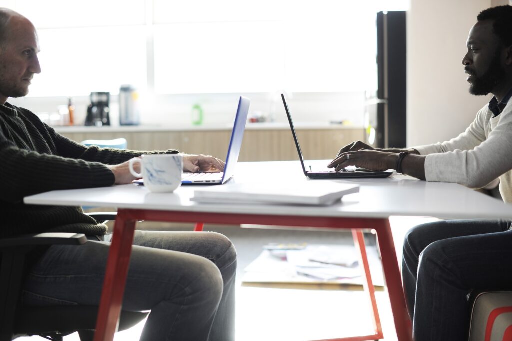 two men at a desk working